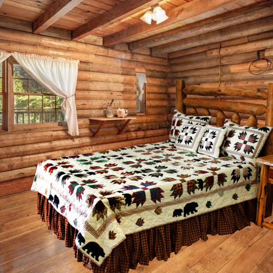 Patch Magic’s There Were Bear Quilt - This quilt transports you to the forest, complete with bears and their paws. Crisp leaves in bright greens, warm browns, burgundy, and sunflower colors arise from the white background where the Bears are trailing around, in, and out.