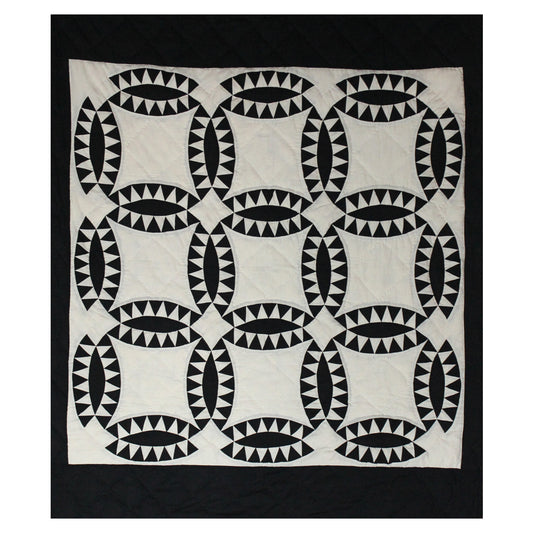 Patch Magic’s Coal Wedding Ring Quilt - This coal black rings with white feathers adorn this quilt having a white background and black border. It is 100% Cotton shell and hand layered organic cotton fill. It is hand quilted and hand layered for a unique soft touch and warmth.