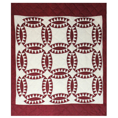 Patch Magic’s Ruby wedding ring quilt  This quilt portrays attractive ruby red wedding rings with hound tooth encircling them which will give warmth to you and make you feel cozy.