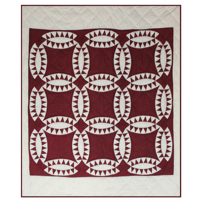 Patch Magic’s Red wedding ring quilt - This quilt depicts attractive red wedding rings with hound tooth encircling them which will give warmth to you and makes you cozy.